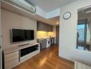 Compact modern studio apartment interior with integrated appliances
