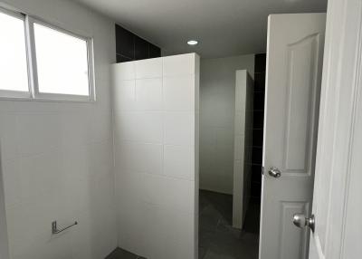 Modern bathroom with gray floor tiles and white wall tiles