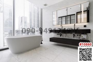 Modern bathroom with freestanding tub and double vanity