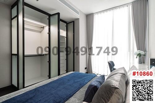 Modern bedroom with large bed and built-in wardrobe