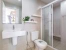 Modern bathroom with walk-in shower and neutral tiles