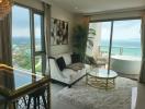 Spacious living room with ocean view, modern furniture, and an elegant bathtub