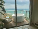 Elegant bedroom with a luxurious Jacuzzi overlooking a scenic sea view