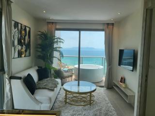 Modern bedroom with ocean view and in-room bathtub