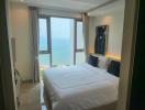 Spacious bedroom with ocean view and ample natural light