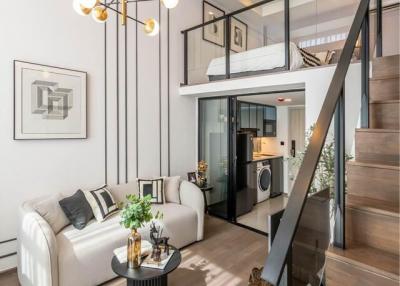 Modern living room with open concept, natural lighting, and a mezzanine level