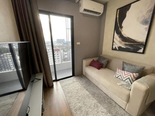 Modern living room with balcony access and city view