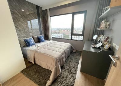 Modern bedroom with a city view