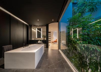 Modern bathroom with large bathtub and elegant interior design