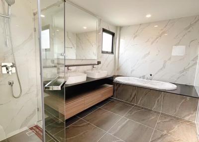 Modern bathroom with walk-in shower and separate bathtub