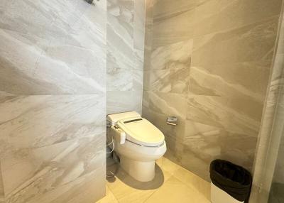 Modern bathroom with beige marble tiles