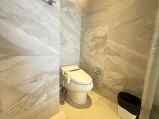 Modern bathroom with beige marble tiles