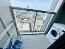High-rise apartment laundry room with city view