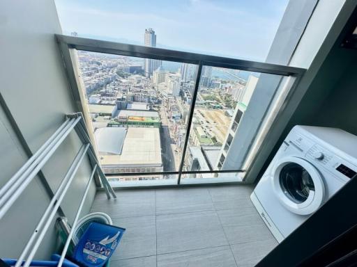 High-rise apartment laundry room with city view