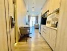 Modern kitchen with dining area leading to a cozy living room