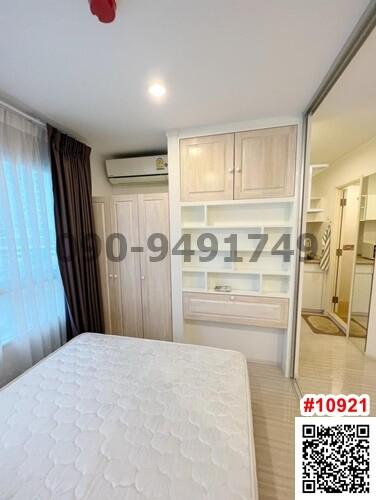 Compact bedroom with built-in wardrobe and window