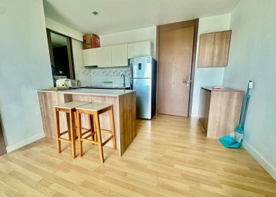 Modern kitchen with wooden cabinets and stainless steel appliances