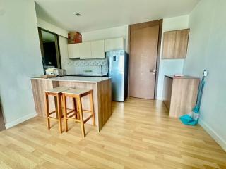 Modern kitchen with wooden cabinets and stainless steel appliances