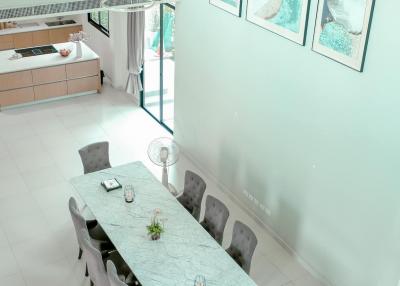 Modern dining room with a large table and artwork on the wall
