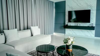 Modern living room interior with marble wall and contemporary furniture