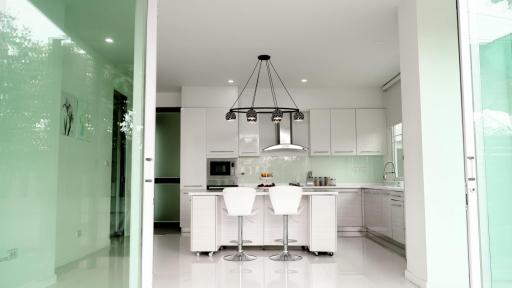 Modern kitchen with center island and elegant pendant lighting