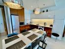 Modern kitchen with dining area and pendant lighting