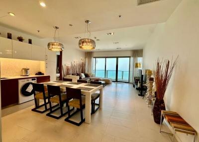 Modern open concept living room and kitchen with ample natural light