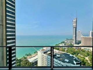 Balcony view overlooking the sea and city skyline