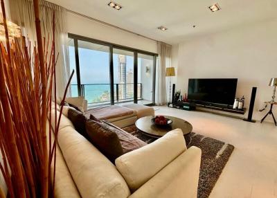 Spacious living room with ocean view and ample natural light