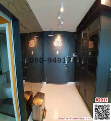 modern apartment entryway with artistic decor and QR code