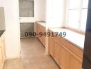 Spacious kitchen with ample cabinetry and tiled flooring