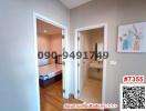 View of a hallway leading to a bedroom and a bathroom in a modern home