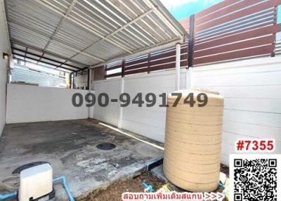 Spacious garage with roof and water tank