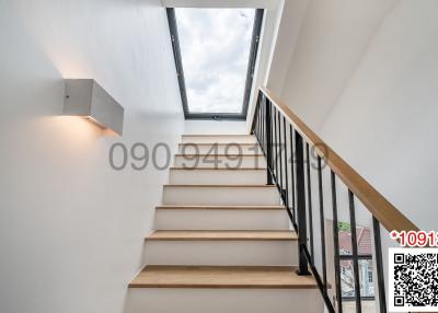 Modern staircase with natural lighting from skylight