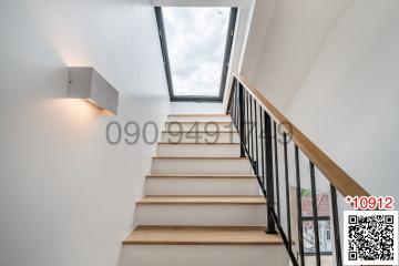 Modern staircase with natural lighting from skylight