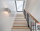 Modern staircase with natural lighting from skylight