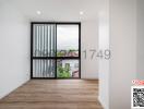 Bright bedroom with large window and wooden floor