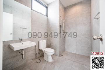 Modern bathroom interior with neutral tiles