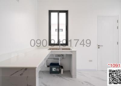 Minimalist home office with white desk and chair