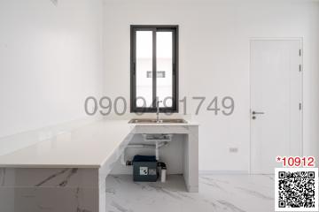 Minimalist home office with white desk and chair