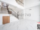 Bright and spacious interior with staircase and marble flooring