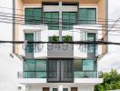 Modern Multi-Story Apartment Building Facade with Balconies and Garage