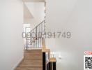 Bright and modern hallway with staircase and hardwood floors