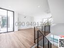 Spacious and bright living room with balcony access and modern finishes