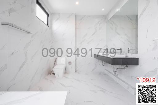 Modern bathroom with marble finish and contemporary fixtures