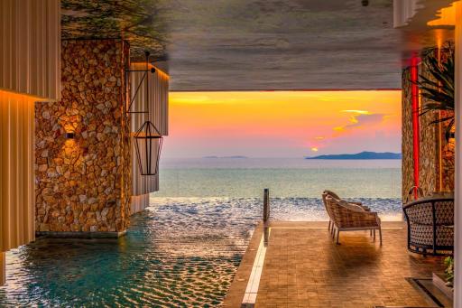 Luxurious outdoor pool overlooking the ocean at sunset
