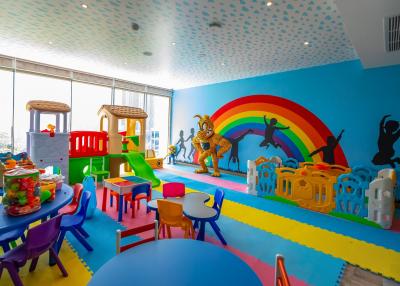 Colorful indoor playroom with toys and child-friendly furniture