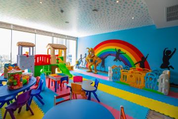 Colorful indoor playroom with toys and child-friendly furniture