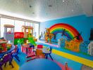 Colorful indoor playroom with toys and child-friendly furniture