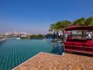 Luxurious infinity pool with city views and lounge area